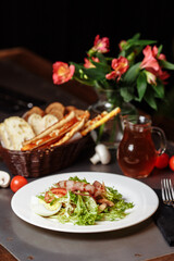 Light salad with vegetables bacon cherry grilled mushrooms tomatoes egg. delicious summer lunch