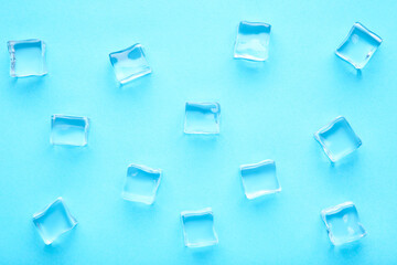 Fototapeta na wymiar Ice cubes on blue background