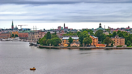 Fototapeta premium Panoramic view of different parts of Stockholm from the observation deck, cloudy summer day with blurry small fragments in the corners of the card