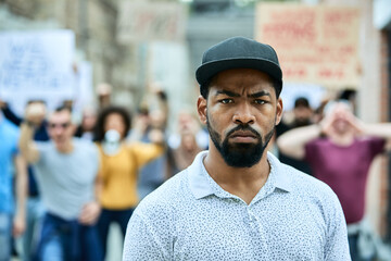 Young African American man participating in protest for black civil rights.