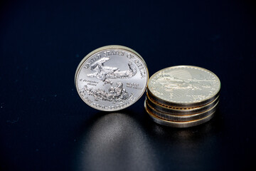 close-up of five gold dollars with a value of 10000 dollars
