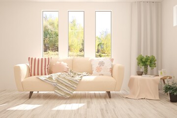 Fototapeta premium White stylish minimalist room with sofa and autumn landscape in window. Scandinavian interior design. 3D illustration