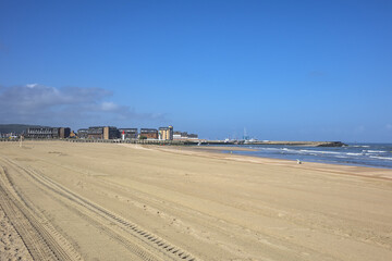Sandy beaches at Trouville on a beautiful summer day. Beach at Trouville, on France's Normandy coast known as Trouville Plage and is backed by a XIX century. Trouville, Normandy, France.