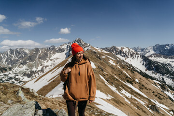  young woman in the mountains. Active rest in one with nature