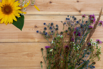 wild flowers on wooden background