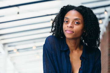 Happy black woman outdoor cafe portrait 