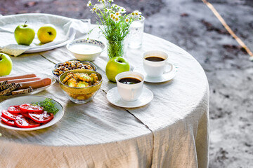 coffee and breakfast on the table outdoor tea party, coffee break outdoor food background top view copy space for text organic healthy eating