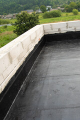 the terrace is covered with a layer of waterproofing roofing material