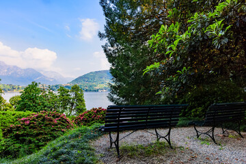A place for rest on the shores of Lake Como, a view of Lake Como, the coastal towns and the surrounding mountains.