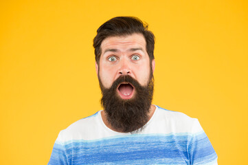 Wow. Real surprise. Man bearded stylish beard yellow background. Barber tips. Beard and mustache. Hipster style. Beard fashion. Barber services. Hairdresser salon. Fancy mustache. Male portrait