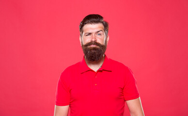 Hairdresser salon. Unshaven man with beard. Portrait of bearded man red background. Brutal guy with...