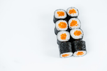 Rolls with red fish, fresh rice with salmon wrapped in nori.