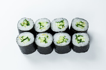 Japanese food. Rolls with ripe cucumber, fresh rice with vegetables in nori. Vegetarian rolls