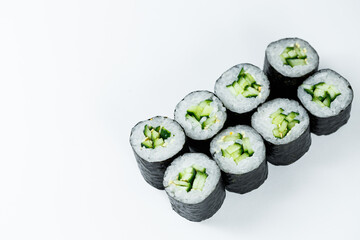 Japanese food. Rolls with ripe cucumber, fresh rice with vegetables in nori. Vegetarian rolls