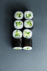 Japanese food. Rolls with ripe cucumber, fresh rice with vegetables in nori. Vegetarian rolls
