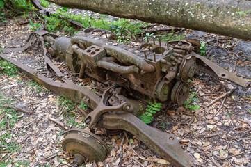 Abandoned rusty truck frame outside