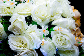 Yellow and white artifical paper flower background. Plastic artificial flower. wedding decoration.