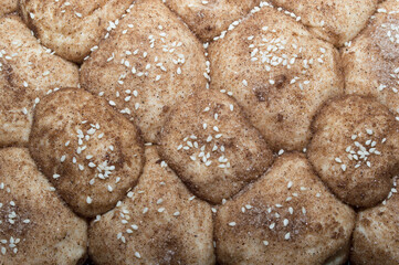 Sweet pastries. Sweet buns with sesame seeds. The process of preparing sweet pastries
