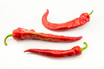 Red hot chili peppers on a white background.