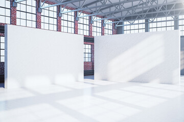 Large red brick hangar interior with two blank banners.