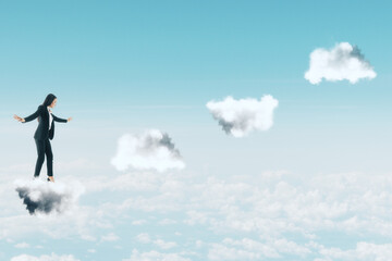 Businesswoman in suit climbing stairs in form of clouds.