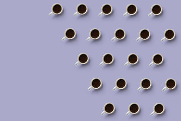 Flat lay of coffee cups forming a texture, with blank space on the left
