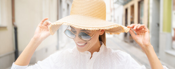 Beautiful woman wearing summer hat