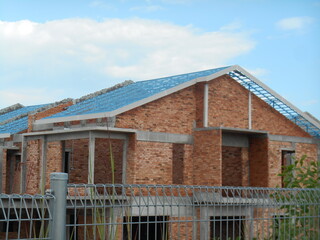SEREMBAN, MALAYSIA -APRIL 07, 2020: New double story luxury terrace house under construction in Malaysia.  Designed by an architect with a modern and contemporary style. 
