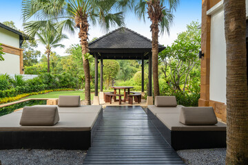exterior design of house, home, pavilion, villa feature outdoor dining table and chairs on balcony outside , pavilion