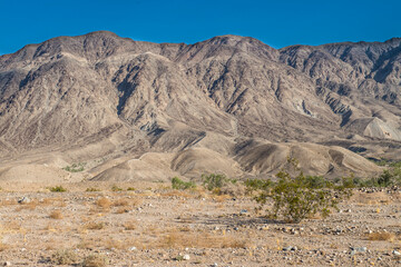landscape, mountains by the road from Mexicali to Tijuana, in the Baja peninsula, MEXICO on a sunny morning, and a blue sky.