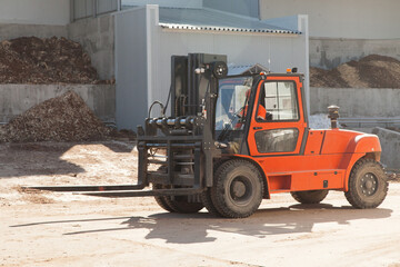 Loader for moving boards in a sawmill
