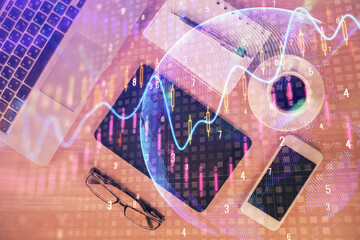 Double exposure of financial graph hologram over desktop with phone. Top view. Mobile trade platform concept.