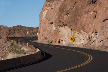Lake Mead NRA, Arizona - March 2019: Kingman Wash Access Road sharp curve around rock wall with...
