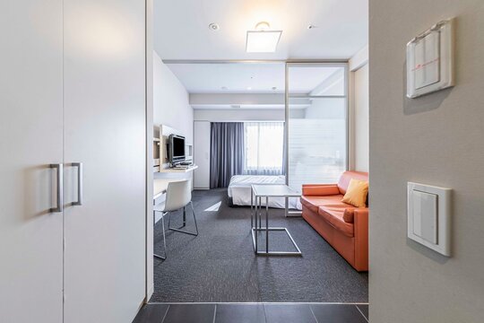 Pictures of living rooms and bedrooms in a modern suite at a urban condominium