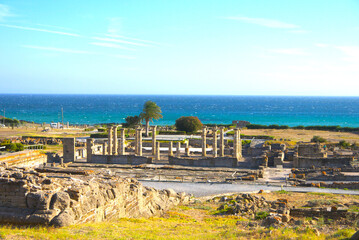 Scenic landscape with ruins of Baelo Claudia is an ancient Roman town on the coast of Spain, Roman city forum, Bolonia, Andalusia, Spain.