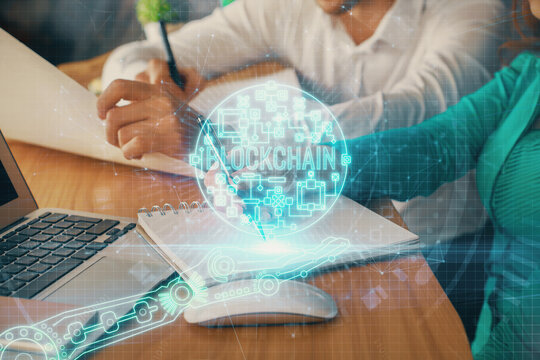 Double exposure of blockchain theme drawing over people taking notes background. Concept of cryptocurrency