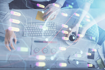 Double exposure of man and woman working together and world map hologram drawing. international network concept. Computer background. Top View.