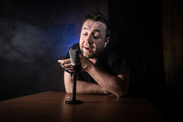 Serious reporter in television studio looking at the camera