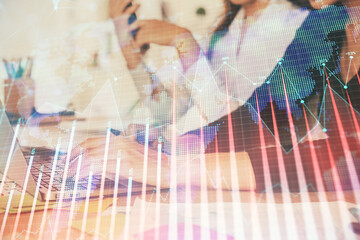 Multi exposure of woman hands typing on computer and financial graph hologram drawing. Stock market...