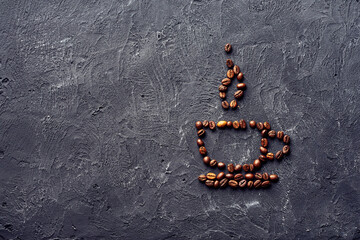 Drawing of a cup and saucer with steam from coffee beans on a gray background