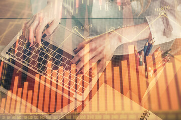Double exposure of woman hands typing on computer and forex chart hologram drawing. Stock market invest concept.