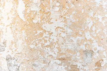 Old wall with peeling white paint