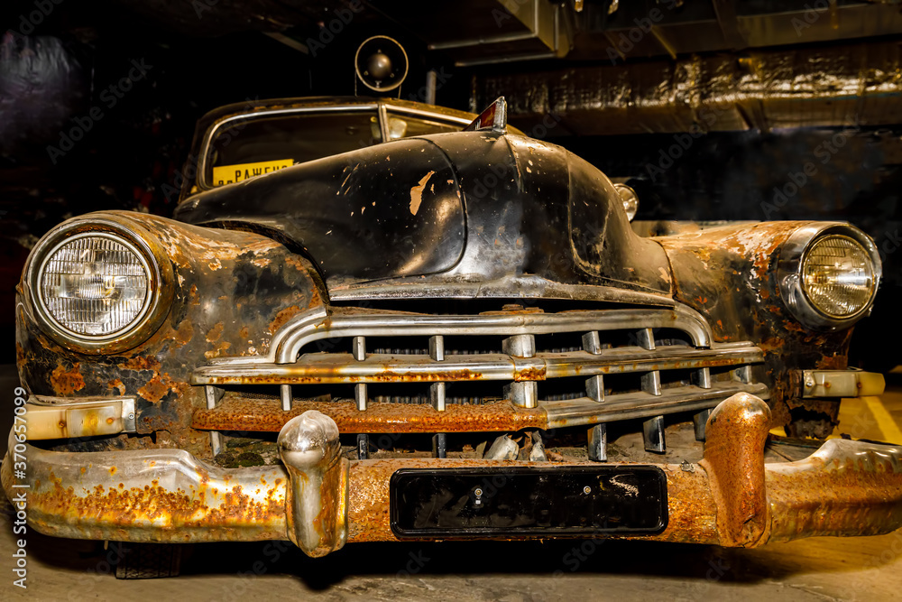 Poster old rusty retro car of black color.