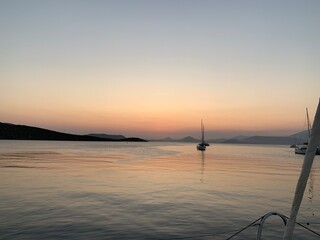 Landscape view of boating sea coast at sunset from catamaran