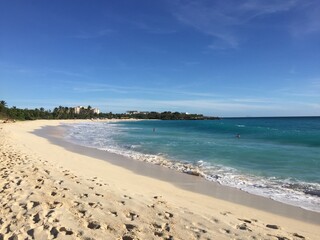 Landscape view of sandy beach coastline at sunrise