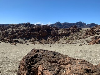 Landscape view of rocky desert mountain terrain under blue skies