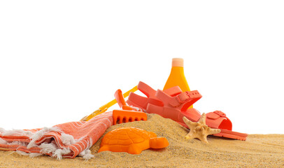 Set of beach accessories for children on sand against white background