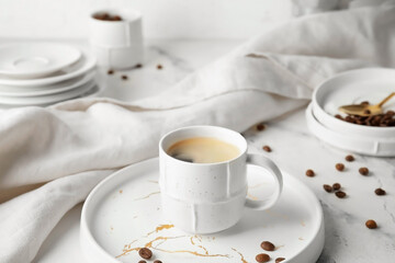 Fototapeta na wymiar Cup of hot coffee on table