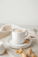 Cup of hot coffee on table