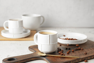 Cup of hot coffee on table